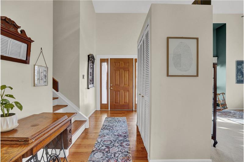 Front Entry with beautiful wood floors and newer wood stairs to the upper level