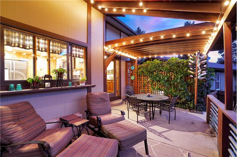 Backyard patio with lighted pergola and built in speakers