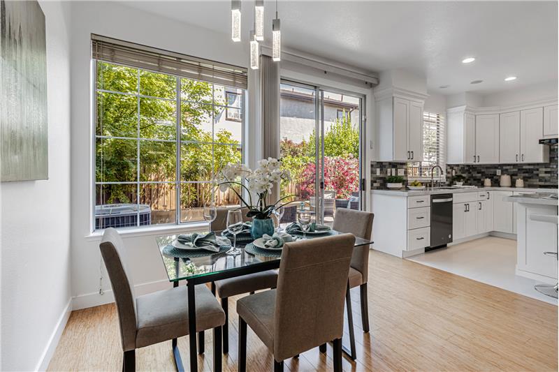 Inviting Dining Area with Views of Lush Outdoor Space!