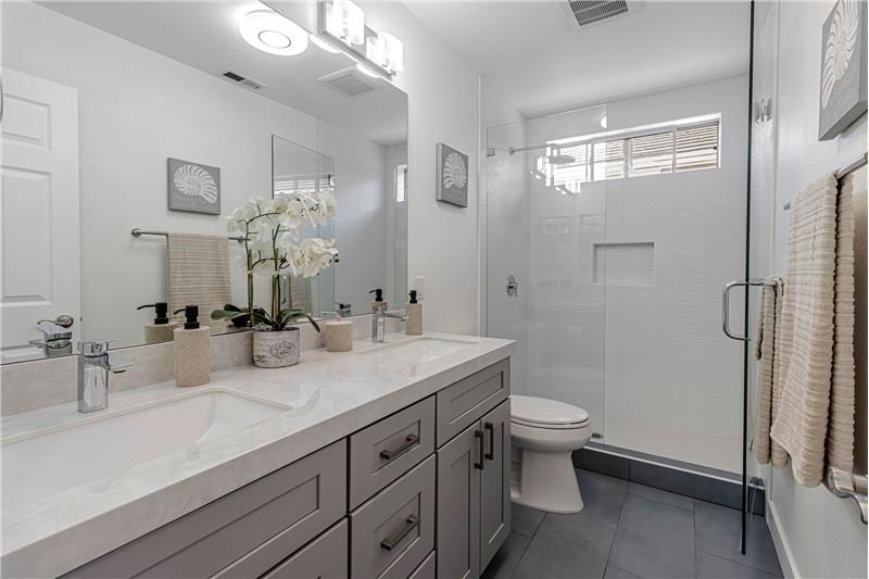 Spacious, Porcelain Tile Dual Sinks!