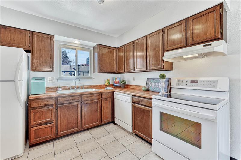 Appliances incl a smooth top range oven, dishwasher, & refrigerator