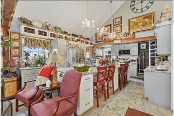 Kitchen with large center island and SS appliances