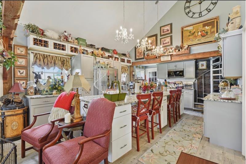 Kitchen with large center island and SS appliances