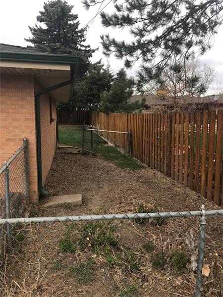 The dog run is behind the garage, with gate to backyard.