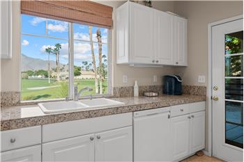 The kitchen has Direct Access to the west patio