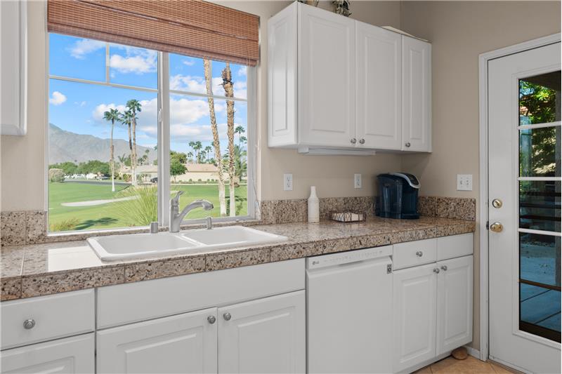 The kitchen has Direct Access to the west patio