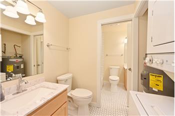 Brand new hot water heater and laundry in home.