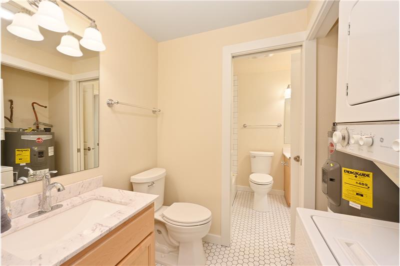 Brand new hot water heater and laundry in home.