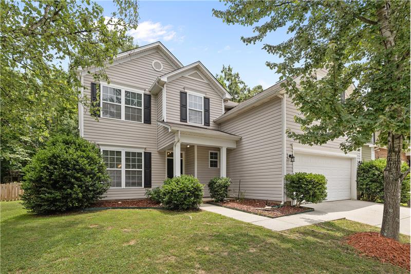 Home offers great curb appeal with well-maintained, lush landscaping that creates a warm and inviting first impression