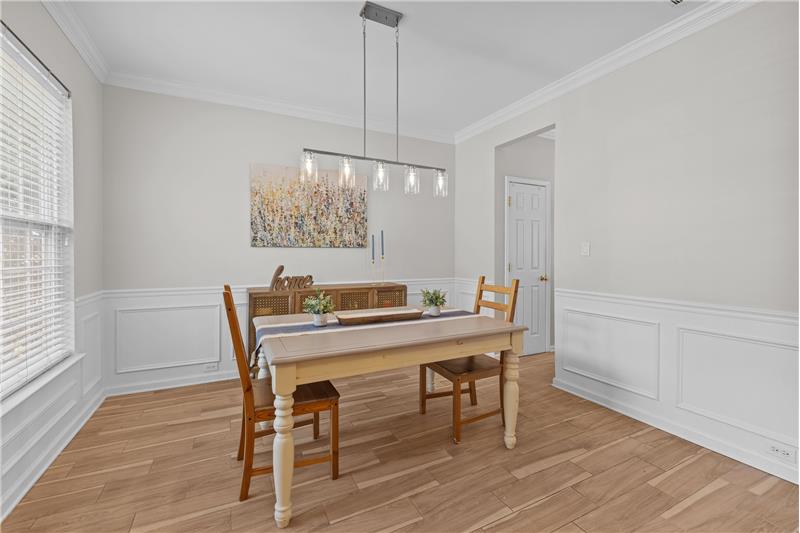 Recently painted dining room, featuring elegant details, is ideal for holiday gatherings and entertaining guests in style