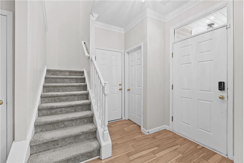 Stair case leading to the second floor landing with loft area