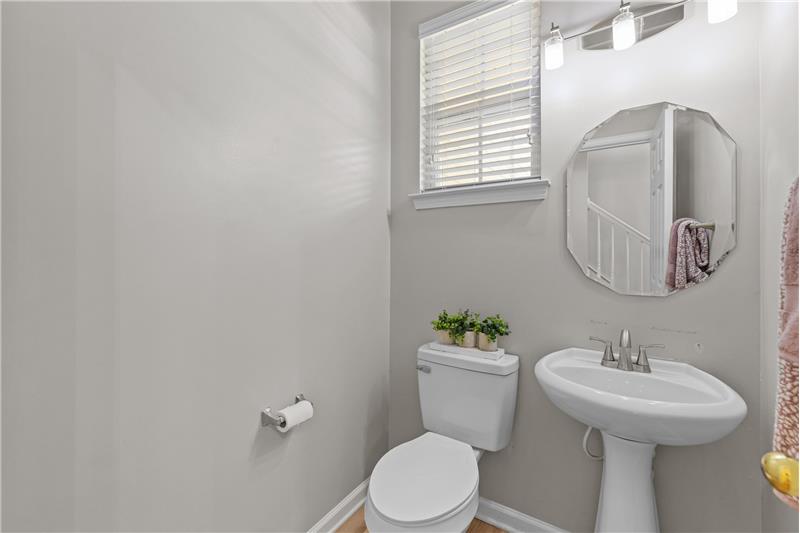 Half bath on main floor, just freshly painted with new light fixture and mirror