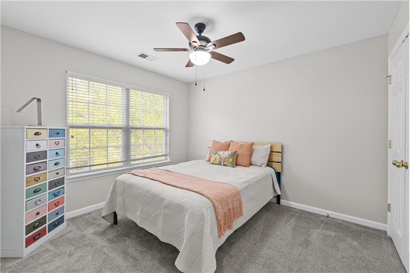 One of three additional bedrooms on second floor of home