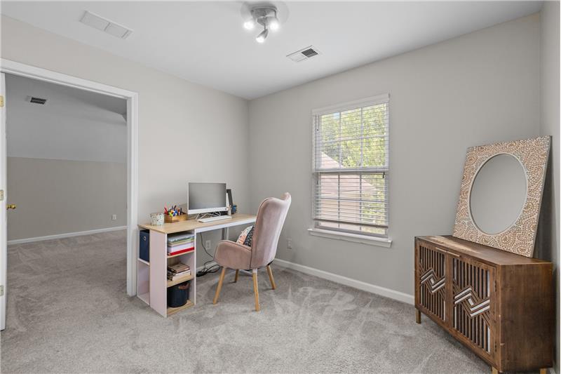Second floor landing provides a cozy space for computer station, study area, reading nook