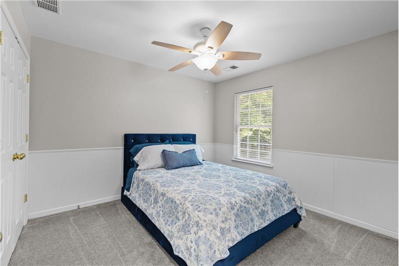 One of three additional bedroom on second floor of home