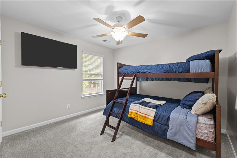 One of three additional bedrooms on second floor of home