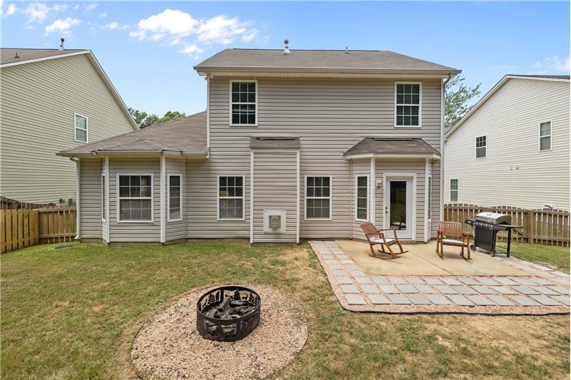 View of back of home, patio, fire pit