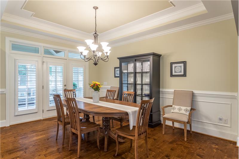 Wainscoting and trey ceiling in large dining room
