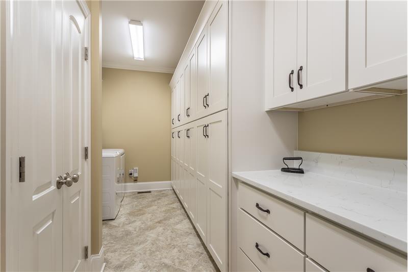 Expansive Laundry Room with a Cabinet for everything!