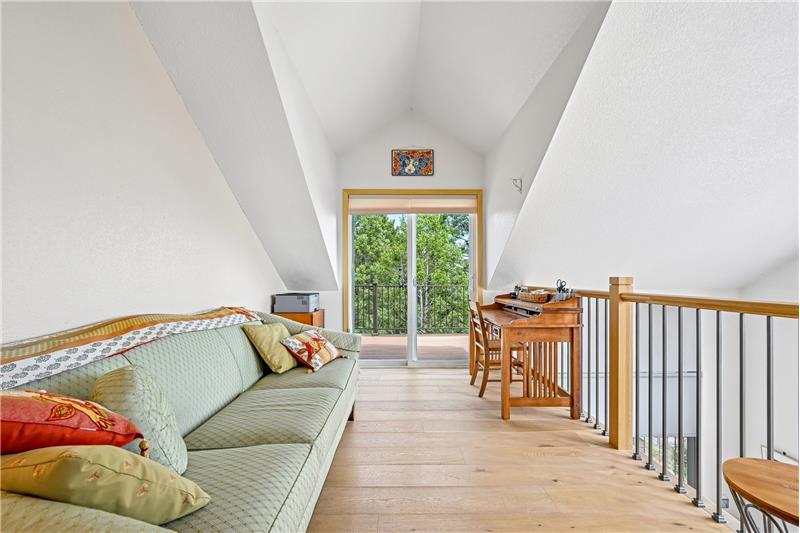 Reverse view of loft showing door to deck