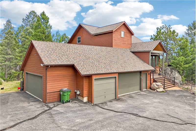 Elevated view showing 3-car garage and shed/garage at left