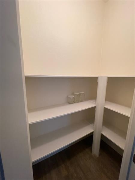 There is room in the walk-in pantry to add more shelving