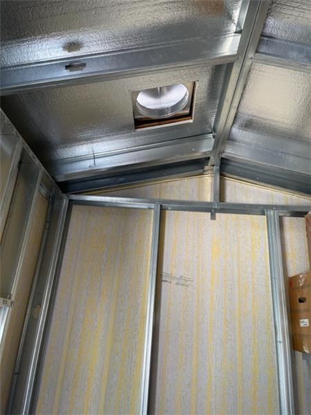 Inside the steel frame shed