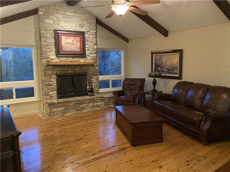 Living area with vaulted ceilings, and fireplace