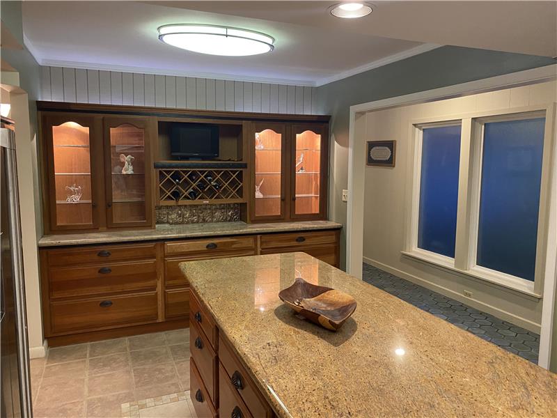 Kitchen island and custom  built ins back lit tray ceiling large island