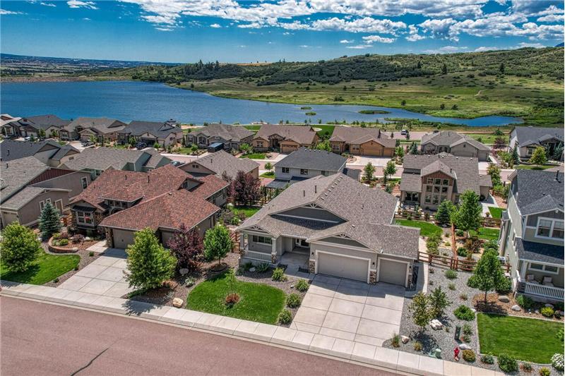 Aerial view of home and lake