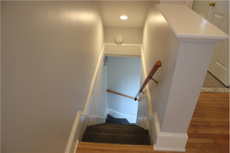Interior Staircase to left, Bathroom Hall to Right