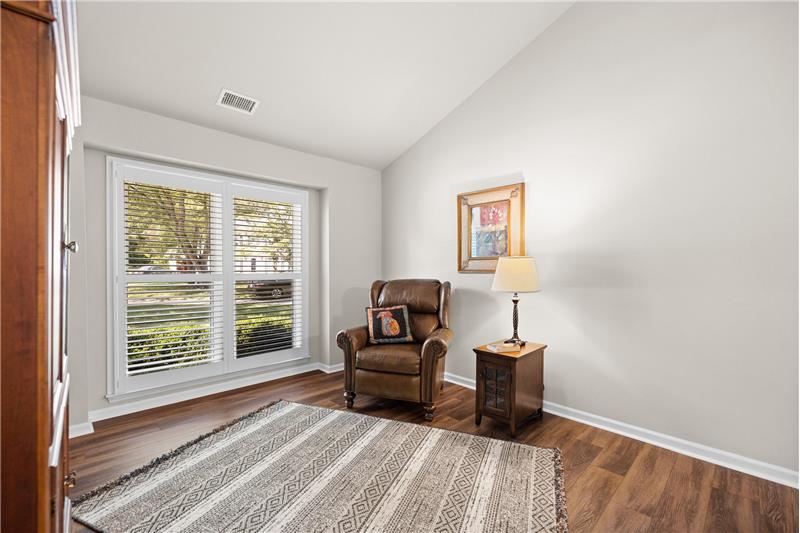 Formal living room; vaulted ceiling; custom plantation shutters