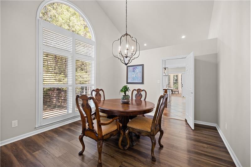Formal dining room; vaulted ceiling; custom plantation shutters