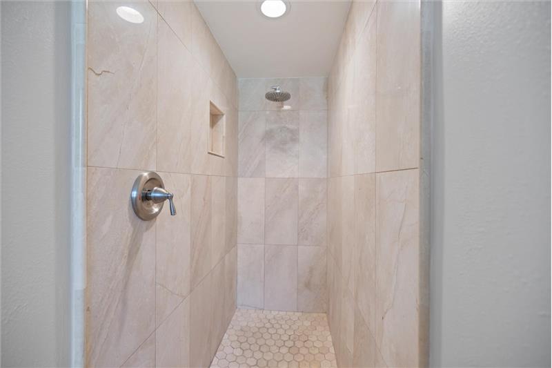 Primary Bathroom- Travertine Walk-in Shower