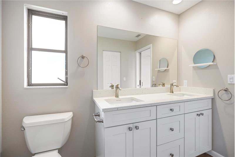 Primary Bathroom-  quartz countertop with mother-of-pearl detail