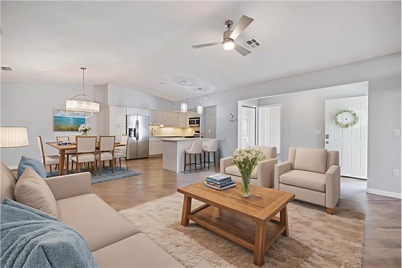Great Room opened to the Kitchen and Dining Area- virtually staged