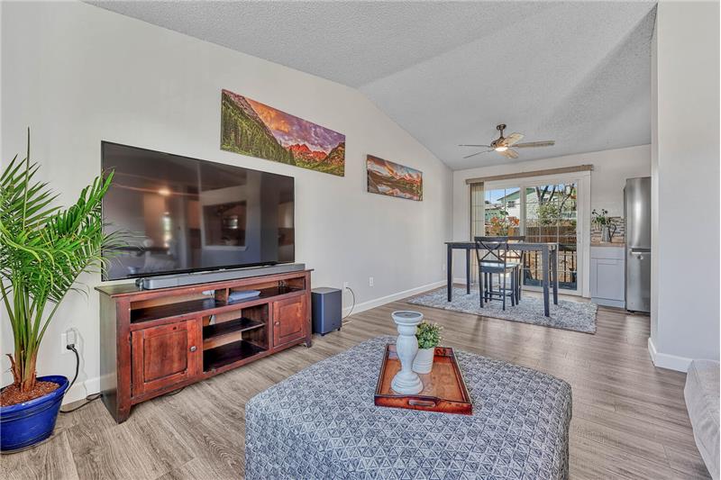 Vaulted Living Room into the Walk Out Dining Room