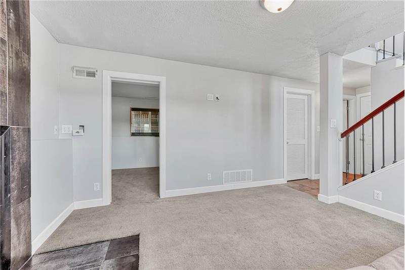 Lower Level Family Room with neutral carpet