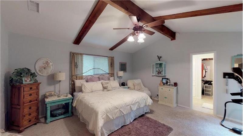 Master bedroom with vaulted ceilings