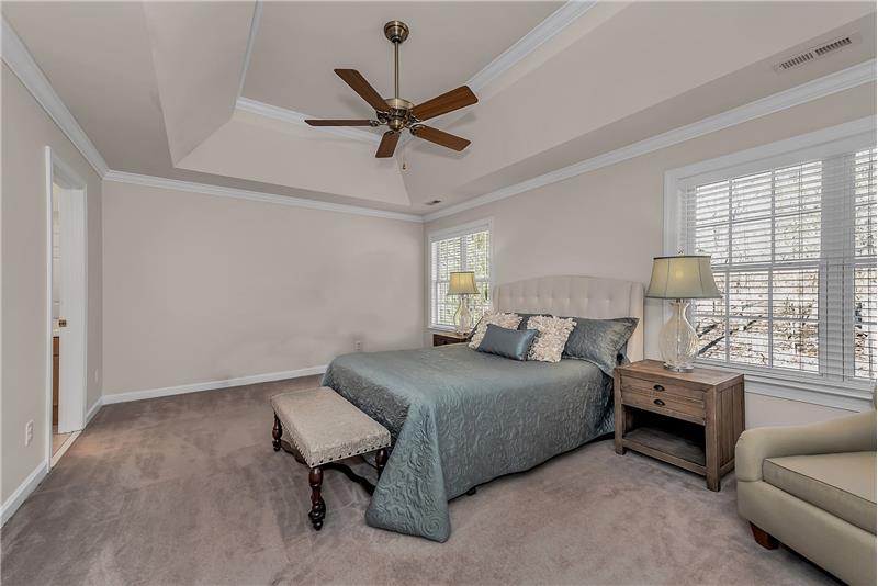 Serene and spacious master bedroom with room for king-size bed, sitting area, and larger dressers/side tables.