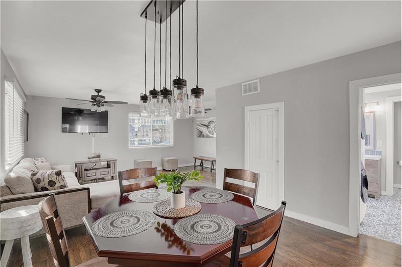 The Dining Room features an upgraded modern light fixture