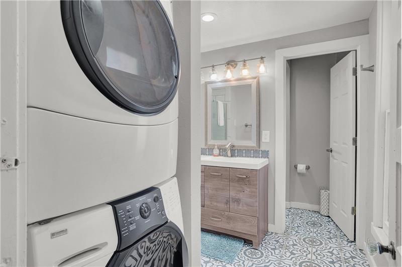 Main level shower bathroom and laundry area with washer/dryer