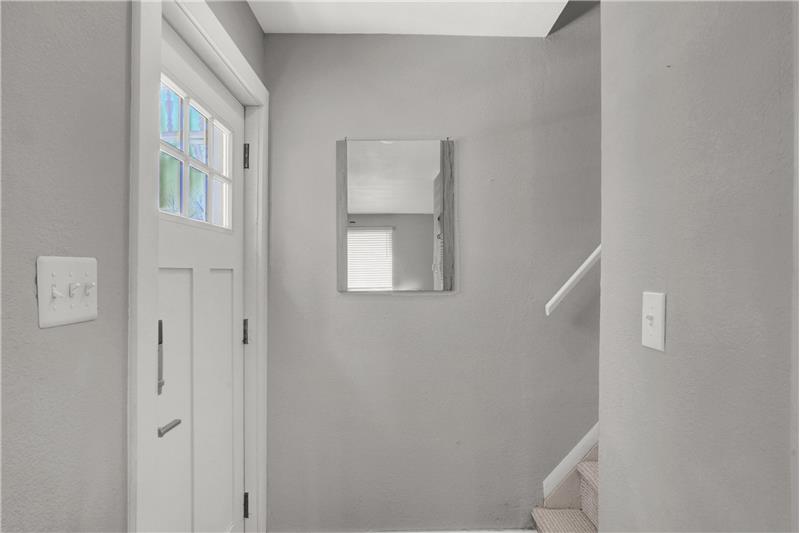 Front Entry with stairs to the upper level