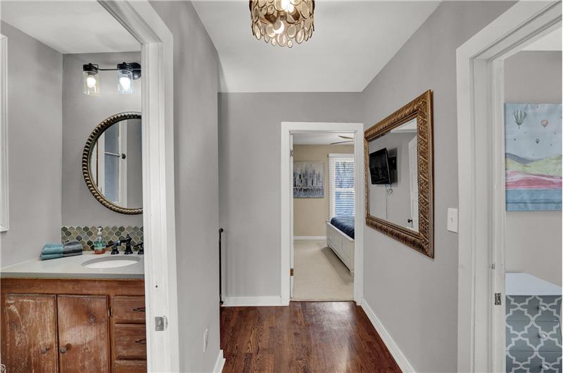 Upper level hallway with entrance into the upper level shower bathroom