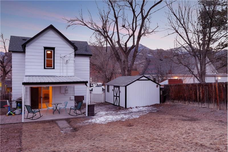 Sunset views of the rear of the home and backyard