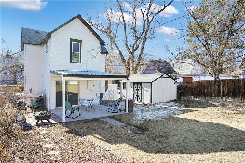 Daytime views of the backyard and covered patio