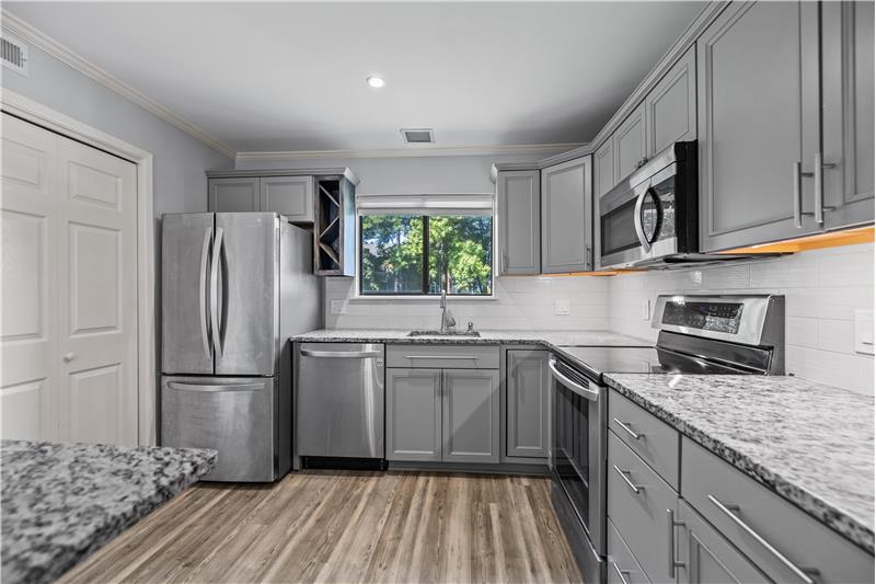 LG stainless steel appliances include a French-door fridge