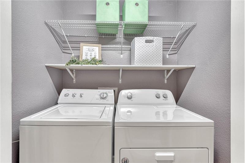 Upper level laundry area with washer and dryer that stays