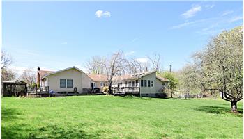 View of the back of the house and the backyard