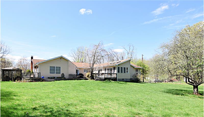 View of the back of the house and the backyard